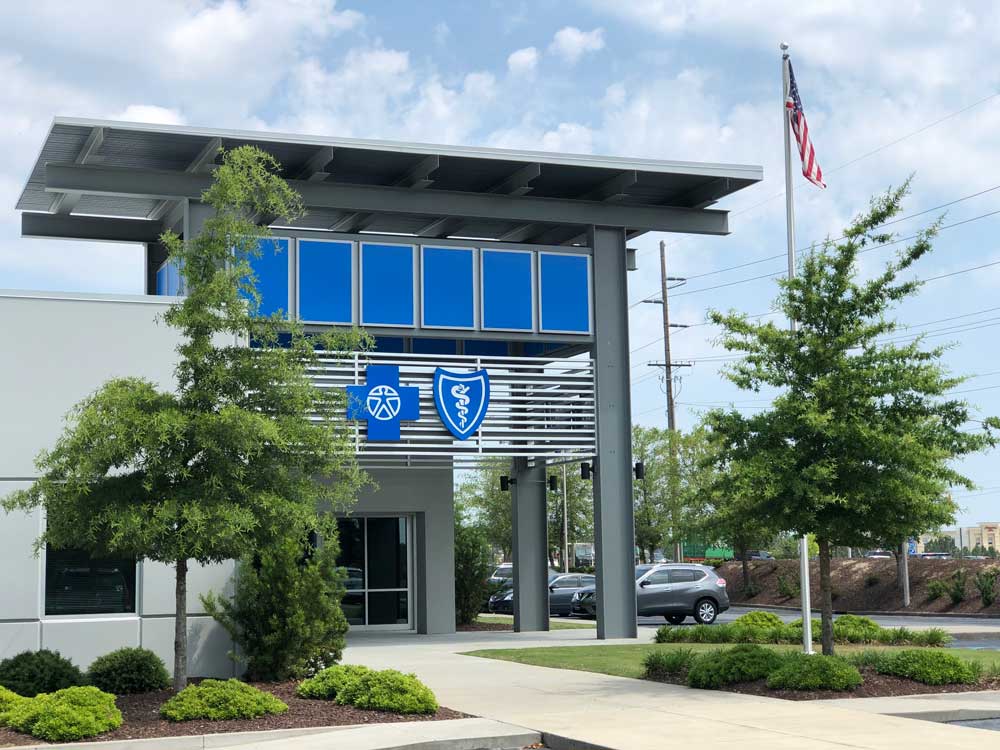 building with blue cross sign