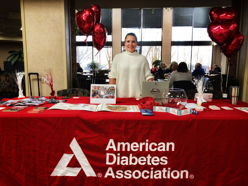 Tifani Moore at an American Diabetes Association table