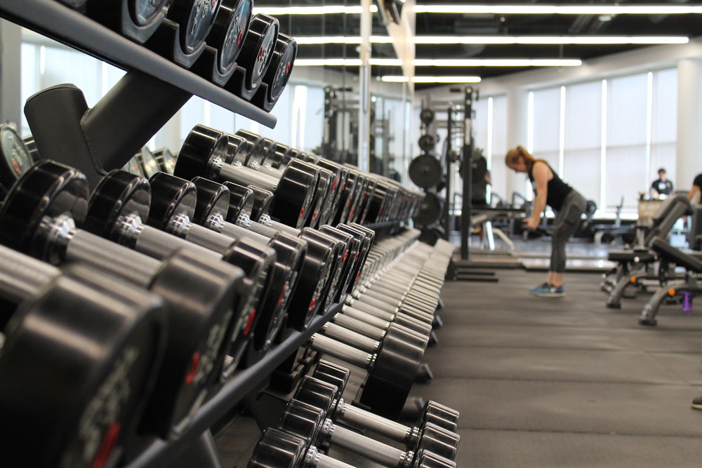 person exercises at on-site fitness facility