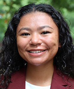 Aiyana Uter, a young female student at Claflin University, smiles into the camera.