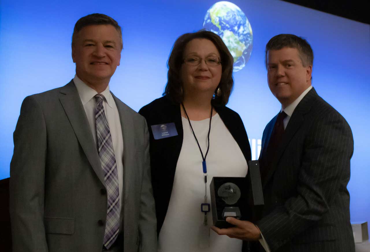 Photo of business professionals at award ceremony