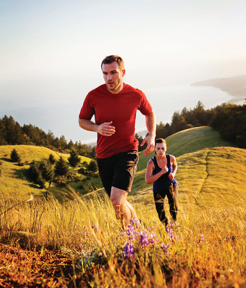 People running up a hill