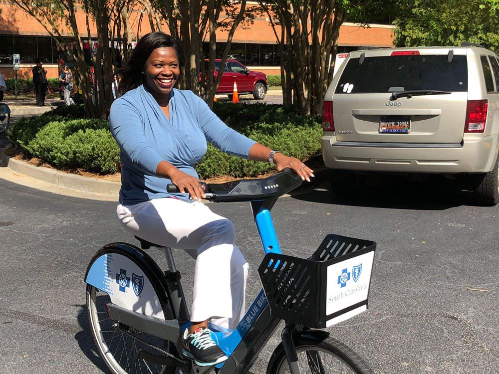 employees try blue bike