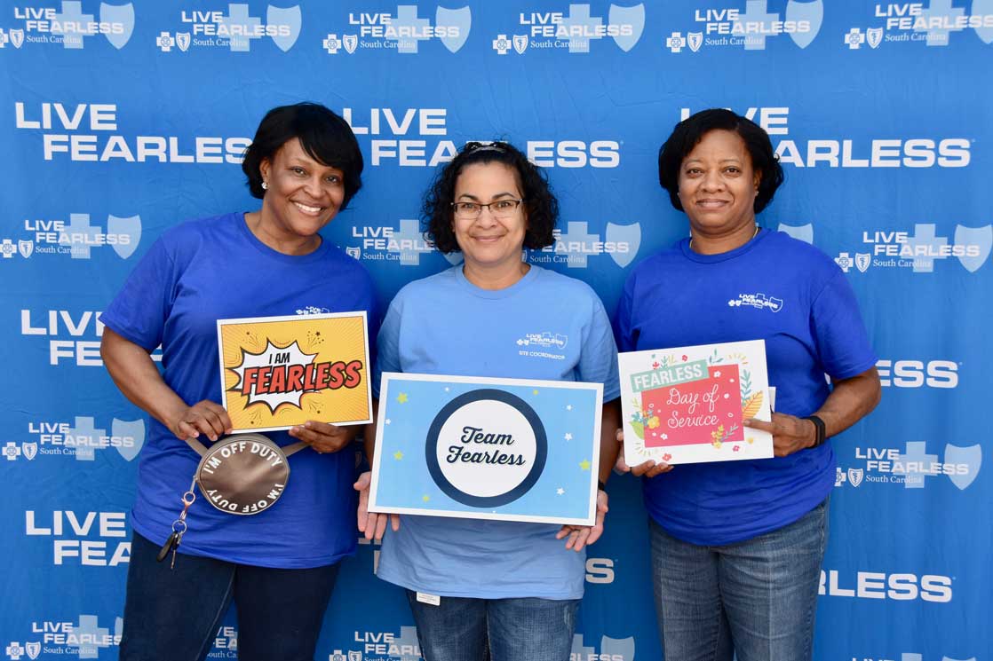 Three employees smiling