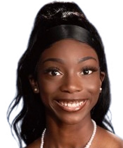 Adrienne Daniels, a young female student at Benedict College, smiles into the camera.